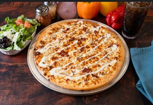 image009 Genos Giant Slice pizza with cheese and bacon toppings on metal tray, served with salad and drink on wooden table